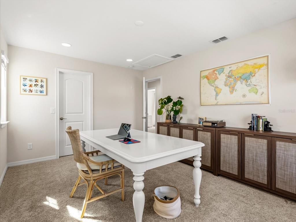 17422 Channel Way Winter Garden, FL 34787 - Photo 29 of 44 a view of a dining room with furniture and wooden floor