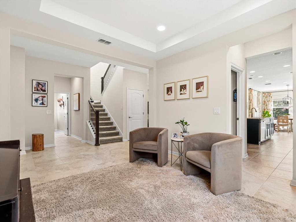 17422 Channel Way Winter Garden, FL 34787 - Photo 3 of 44 a living room with furniture and a wooden floor