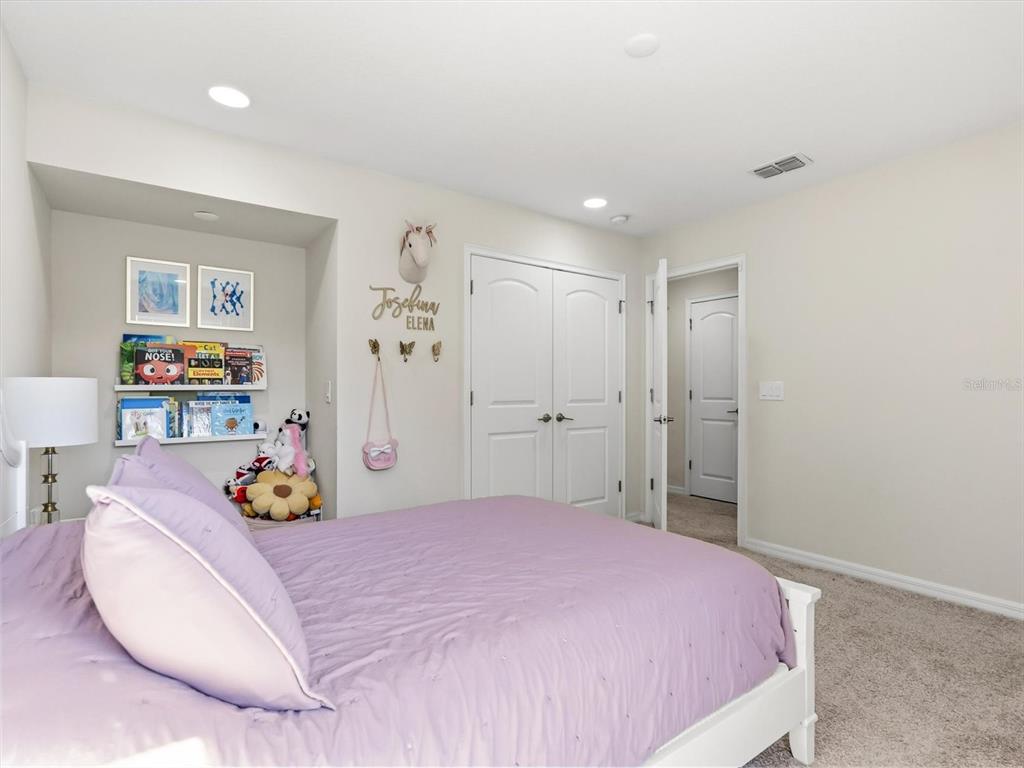 17422 Channel Way Winter Garden, FL 34787 - Photo 31 of 44 a bedroom with a bed and dresser