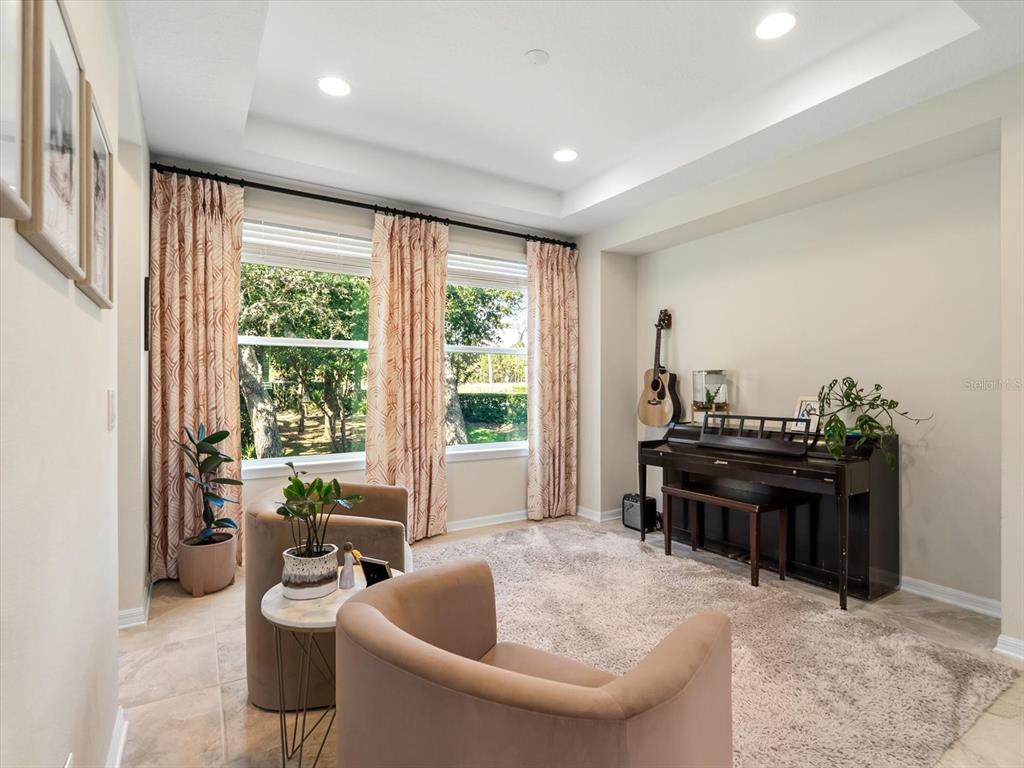 17422 Channel Way Winter Garden, FL 34787 - Photo 6 of 44 a living room with furniture and a floor to ceiling window