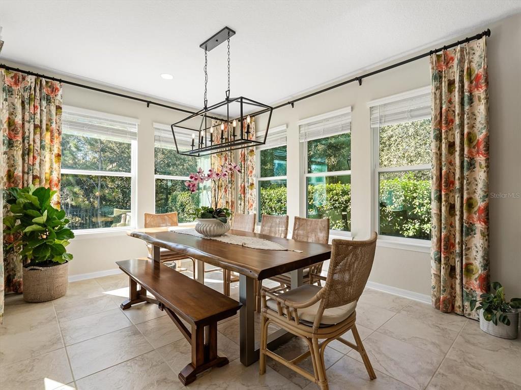 17422 Channel Way Winter Garden, FL 34787 - Photo 7 of 44 a view of a dining room with furniture window and outside view