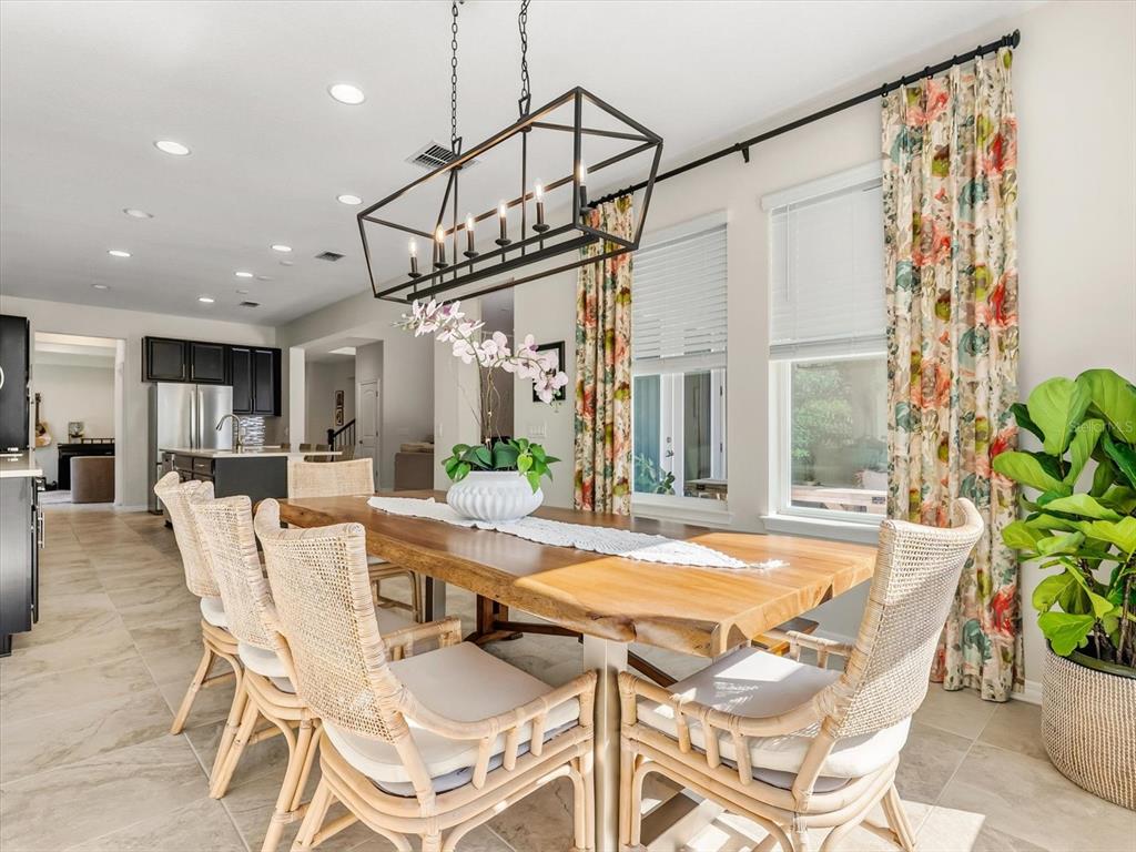 17422 Channel Way Winter Garden, FL 34787 - Photo 8 of 44 a view of a dining room with furniture window and wooden floor