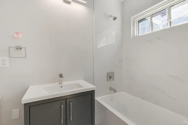a bathroom with a sink and a bathtub