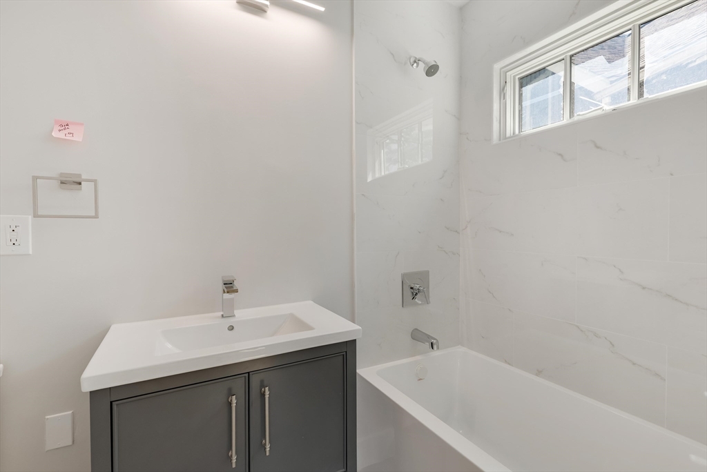 8 Crystal Street, Unit 2 Melrose, MA 02176 - Photo 12 of 17 a bathroom with a sink and a bathtub