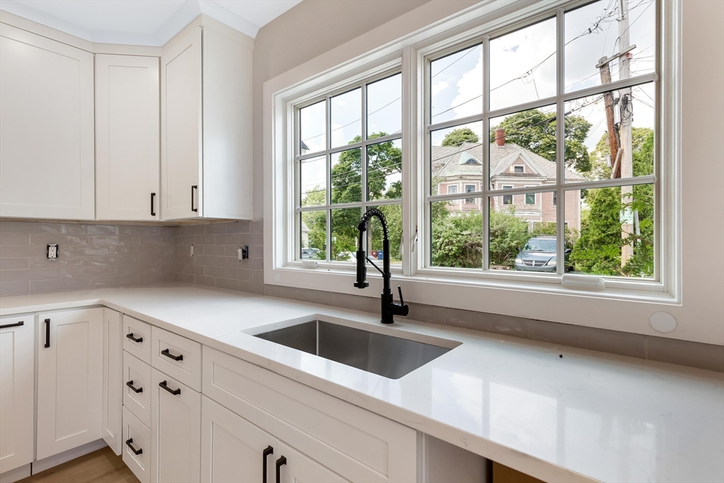 8 Crystal Street, Unit 2 Melrose, MA 02176 - Photo 6 of 17 a kitchen with a sink and large window