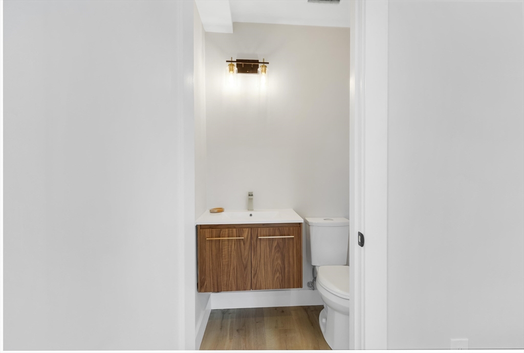 8 Crystal Street, Unit 2 Melrose, MA 02176 - Photo 7 of 17 a bathroom with a sink and a toilet
