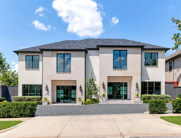 a front view of a house with yard