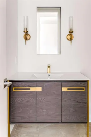 a bathroom with a sink and a mirror