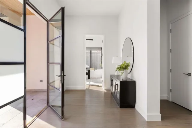 a view of a workspace with furniture and window