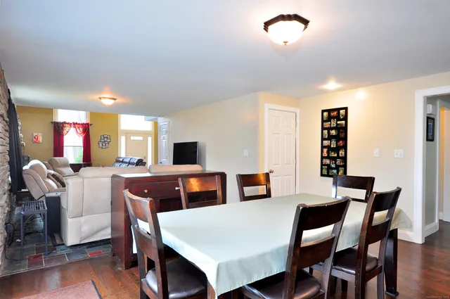 a kitchen with stainless steel appliances granite countertop a stove refrigerator sink and microwave