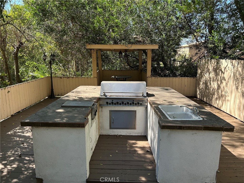 300 South Timken Road Anaheim, CA 92808 - Photo 36 of 40 a view of a patio with a fireplace