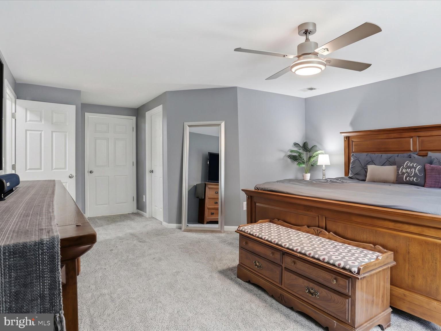 11757 Arbor Glen Way Reston, VA 20194 - Photo 21 of 57 a spacious bedroom with a bed and a dresser