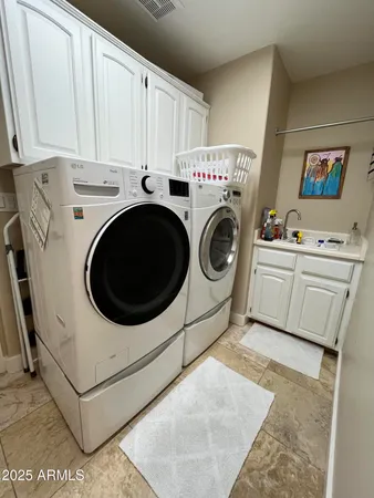 a utility room with dryer and washer