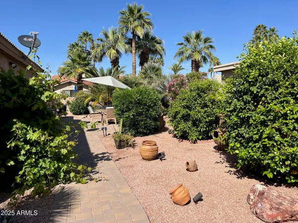 a view of a backyard with sitting area