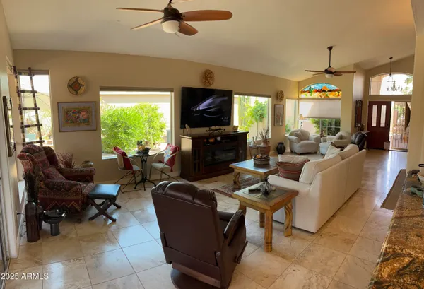 a living room with fireplace furniture and a flat screen tv