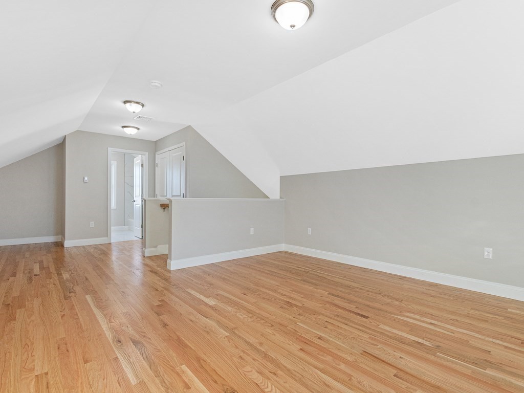 33 Circle Drive Waltham, MA 02452 - Photo 22 of 38 wooden floor in an empty room