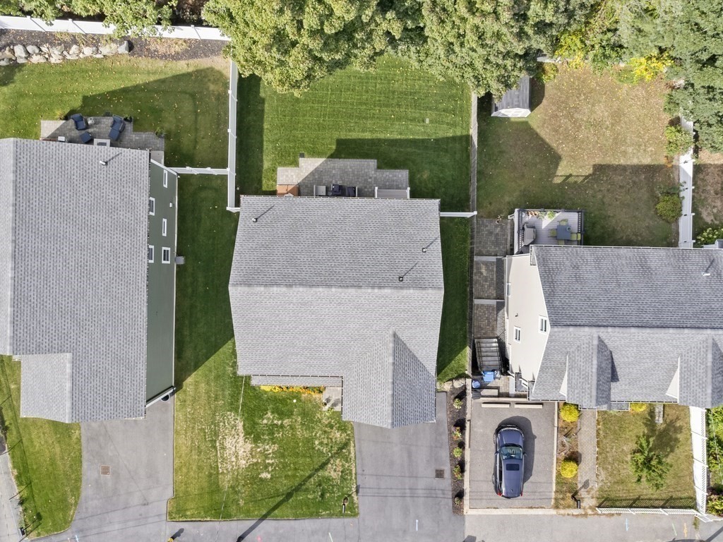 33 Circle Drive Waltham, MA 02452 - Photo 33 of 38 an aerial view of a house with a garden and large trees