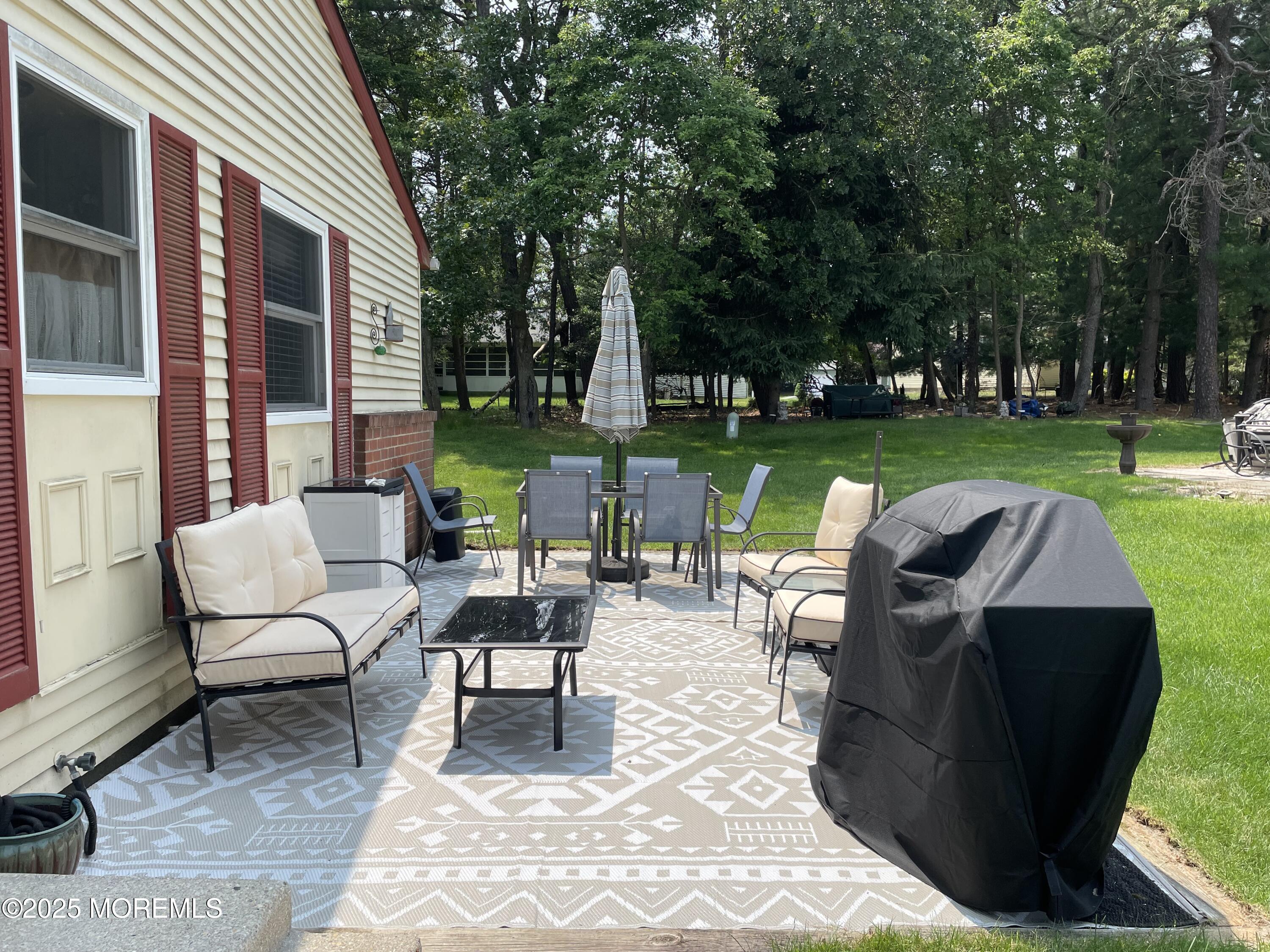 17 B Drake Street Whiting, NJ 08759 - Photo 11 of 18 a view of a patio with couches table and chairs with a yard