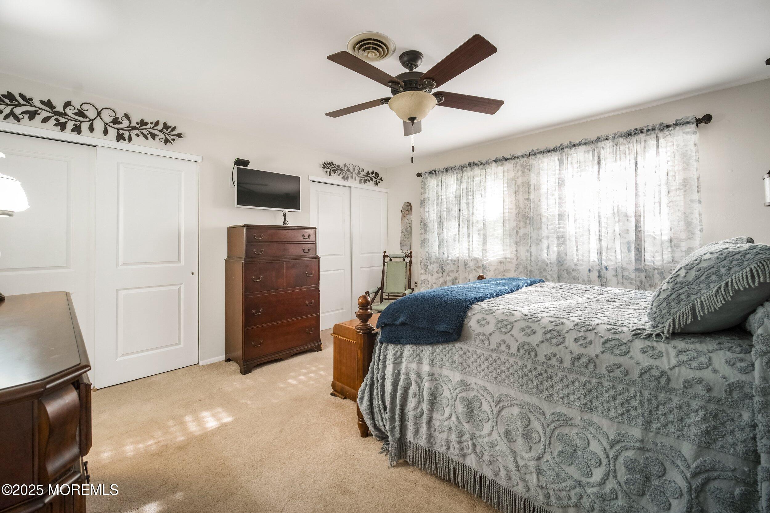 17 B Drake Street Whiting, NJ 08759 - Photo 12 of 18 a bedroom with a bed and a television