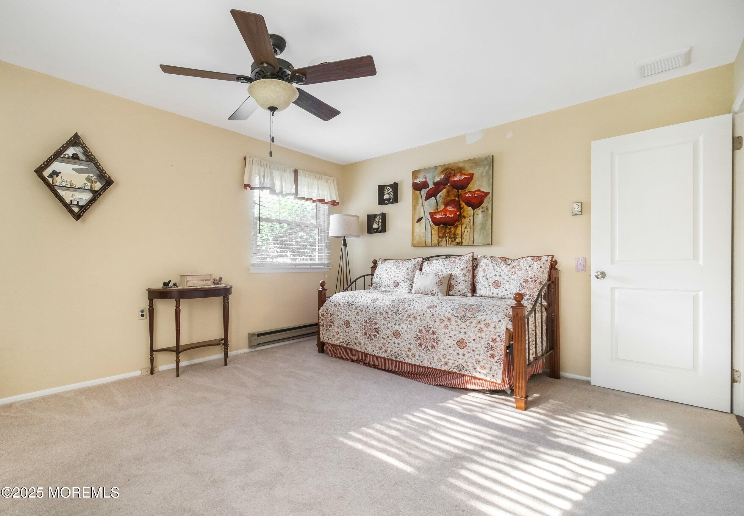 17 B Drake Street Whiting, NJ 08759 - Photo 15 of 18 a bedroom with a bed and a painting on the wall