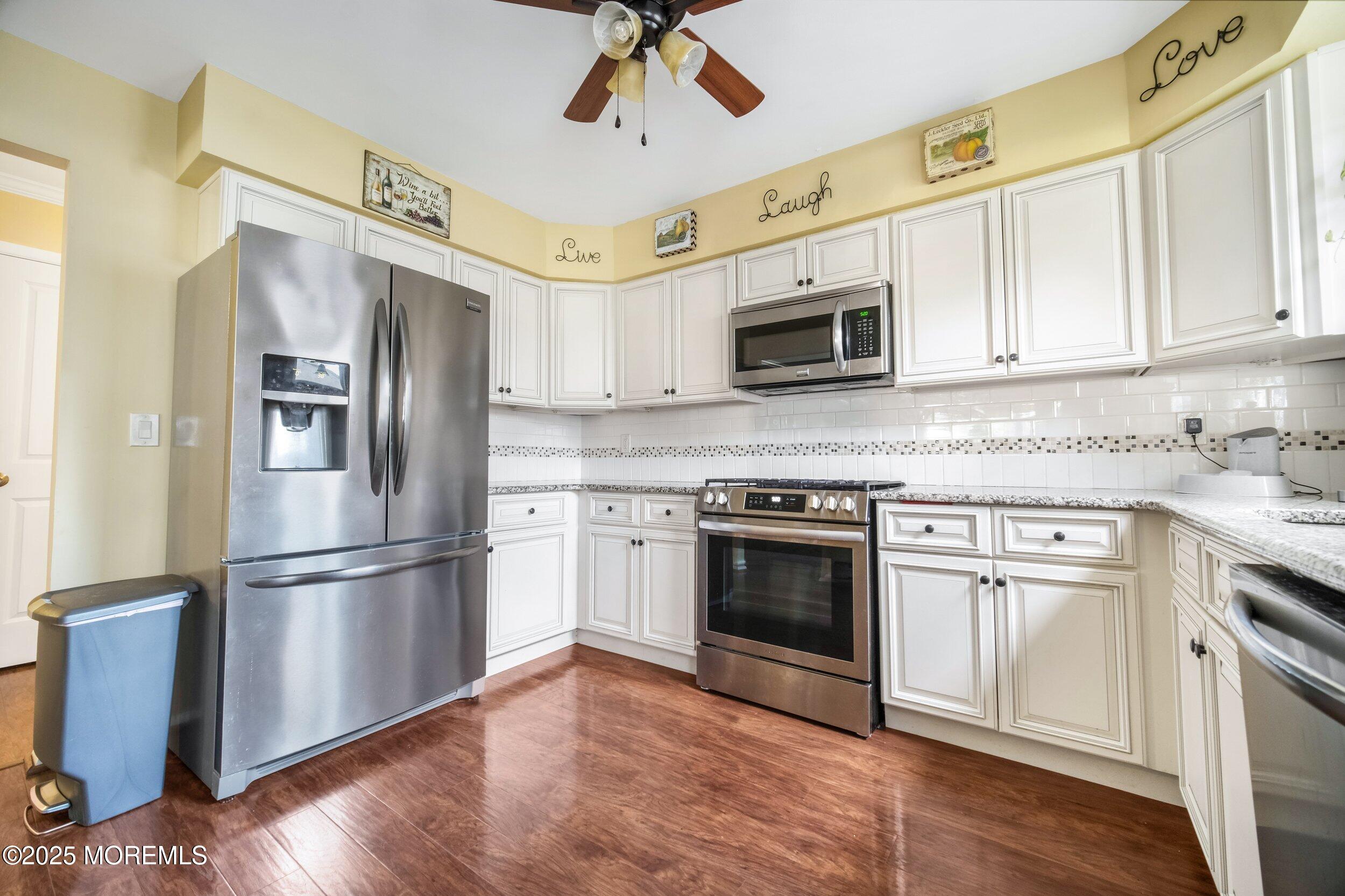 17 B Drake Street Whiting, NJ 08759 - Photo 2 of 18 a kitchen with stainless steel appliances granite countertop a refrigerator microwave and stove top oven