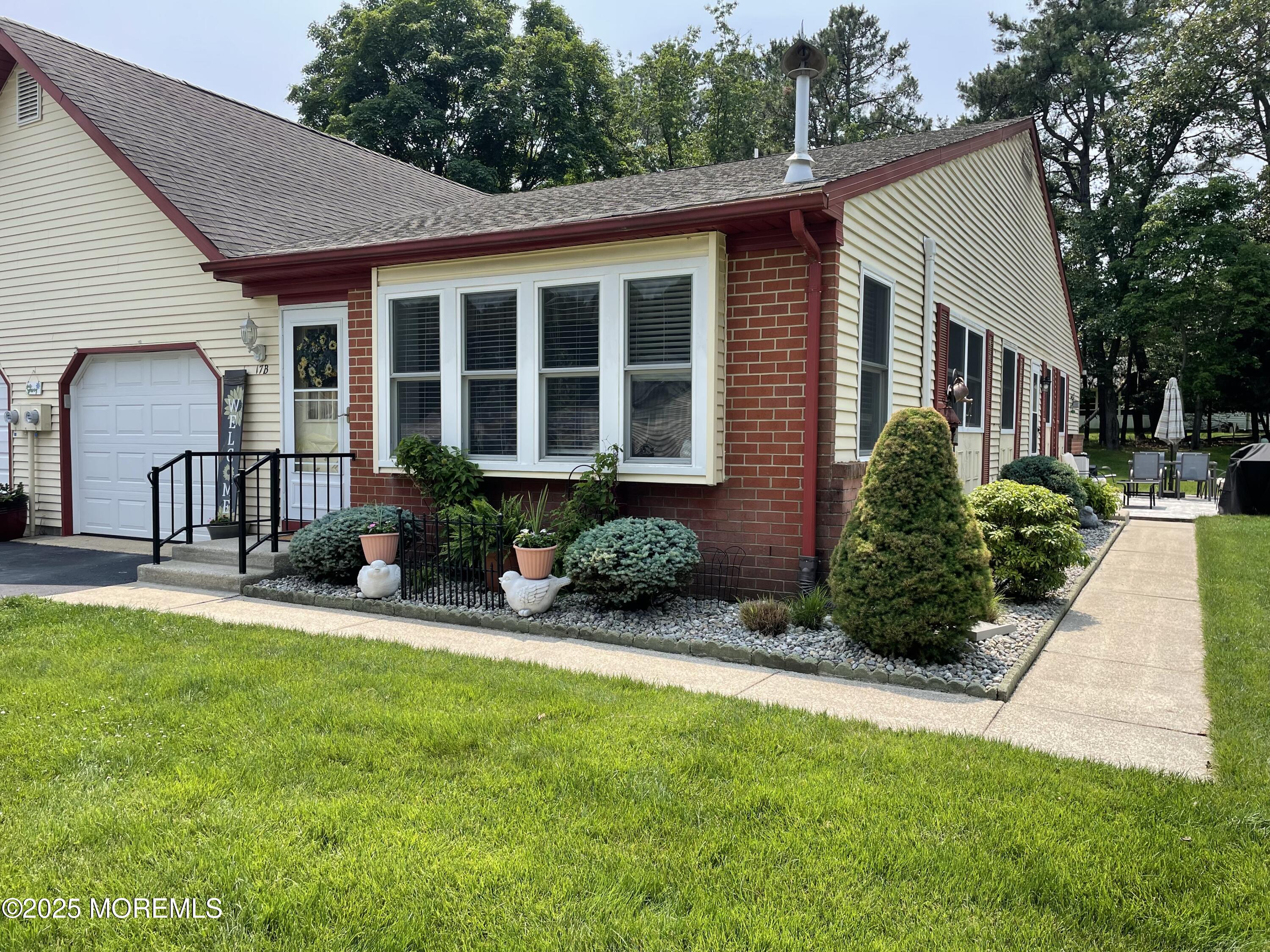 17 B Drake Street Whiting, NJ 08759 - Photo 7 of 18 a front view of a house with porch and garden