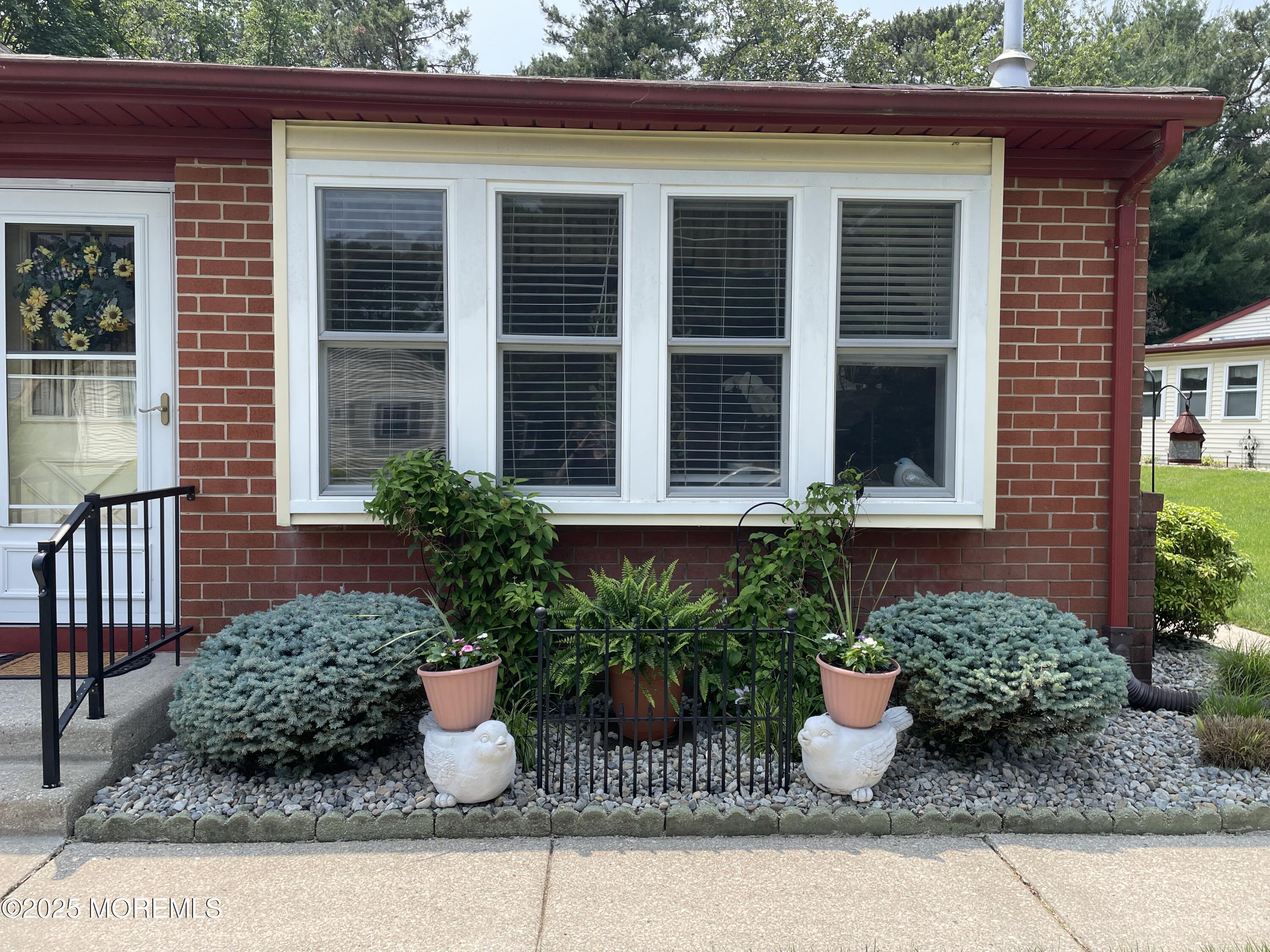 17 B Drake Street Whiting, NJ 08759 - Photo 8 of 18 a house with potted plant in front of it