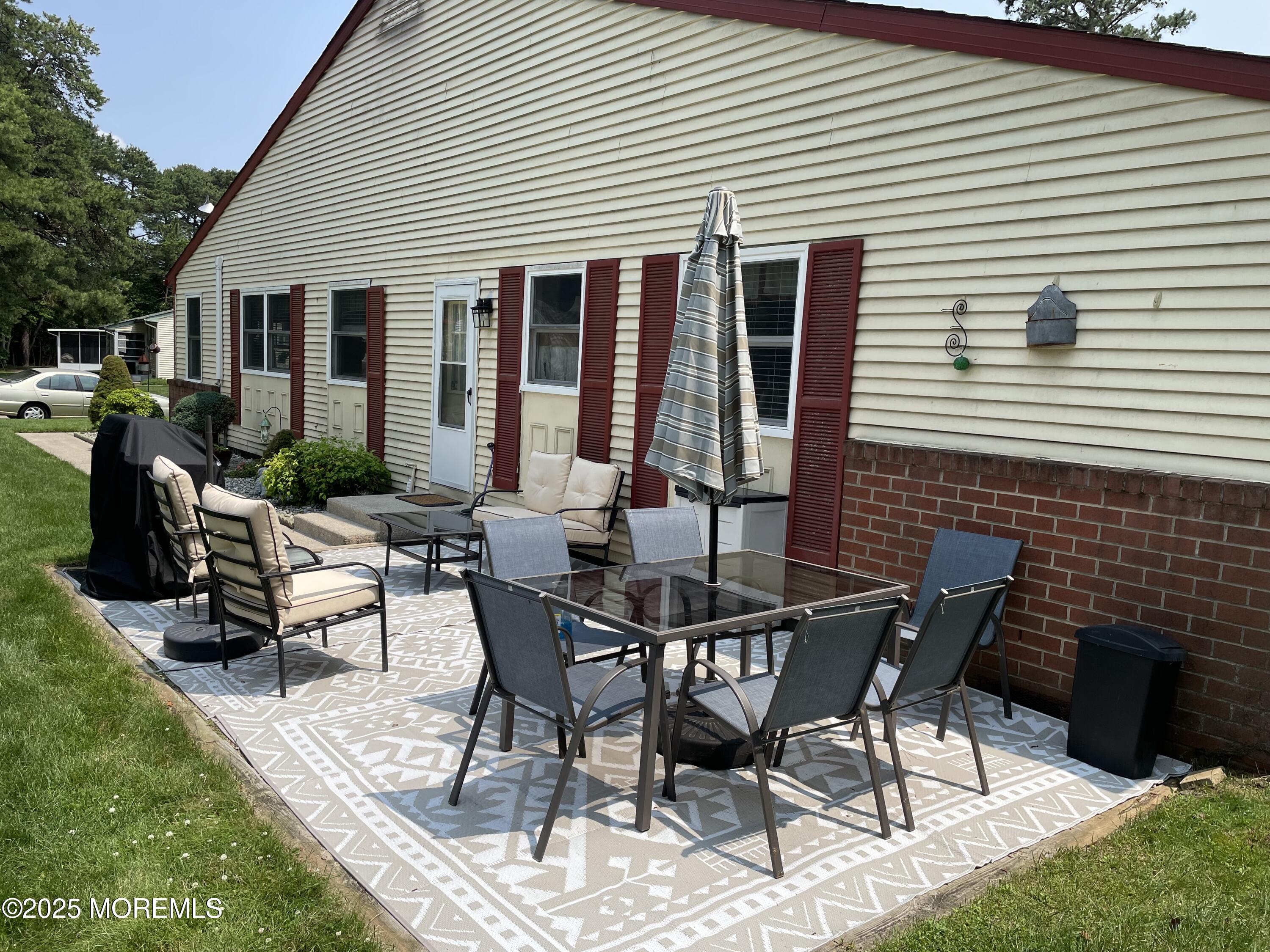 17 B Drake Street Whiting, NJ 08759 - Photo 10 of 18 a view of a house with patio and a yard