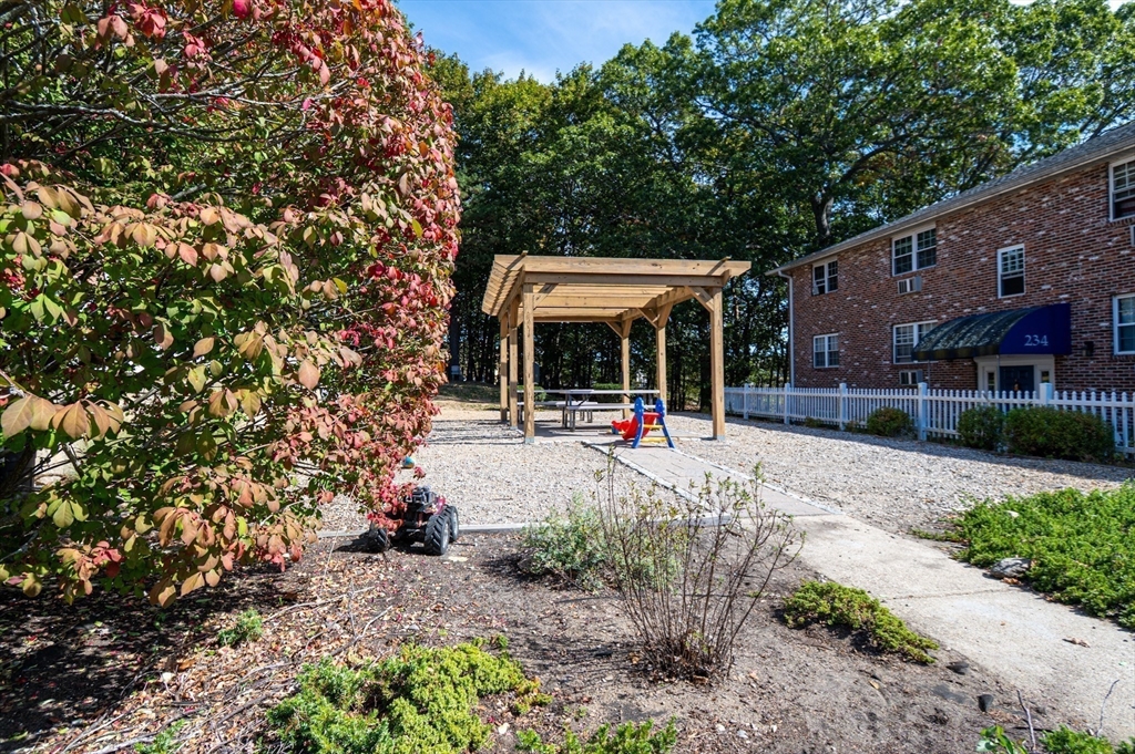 234 Low Street, Unit 3 Newburyport, MA 01950 - Photo 6 of 13 a front view of a house with garden