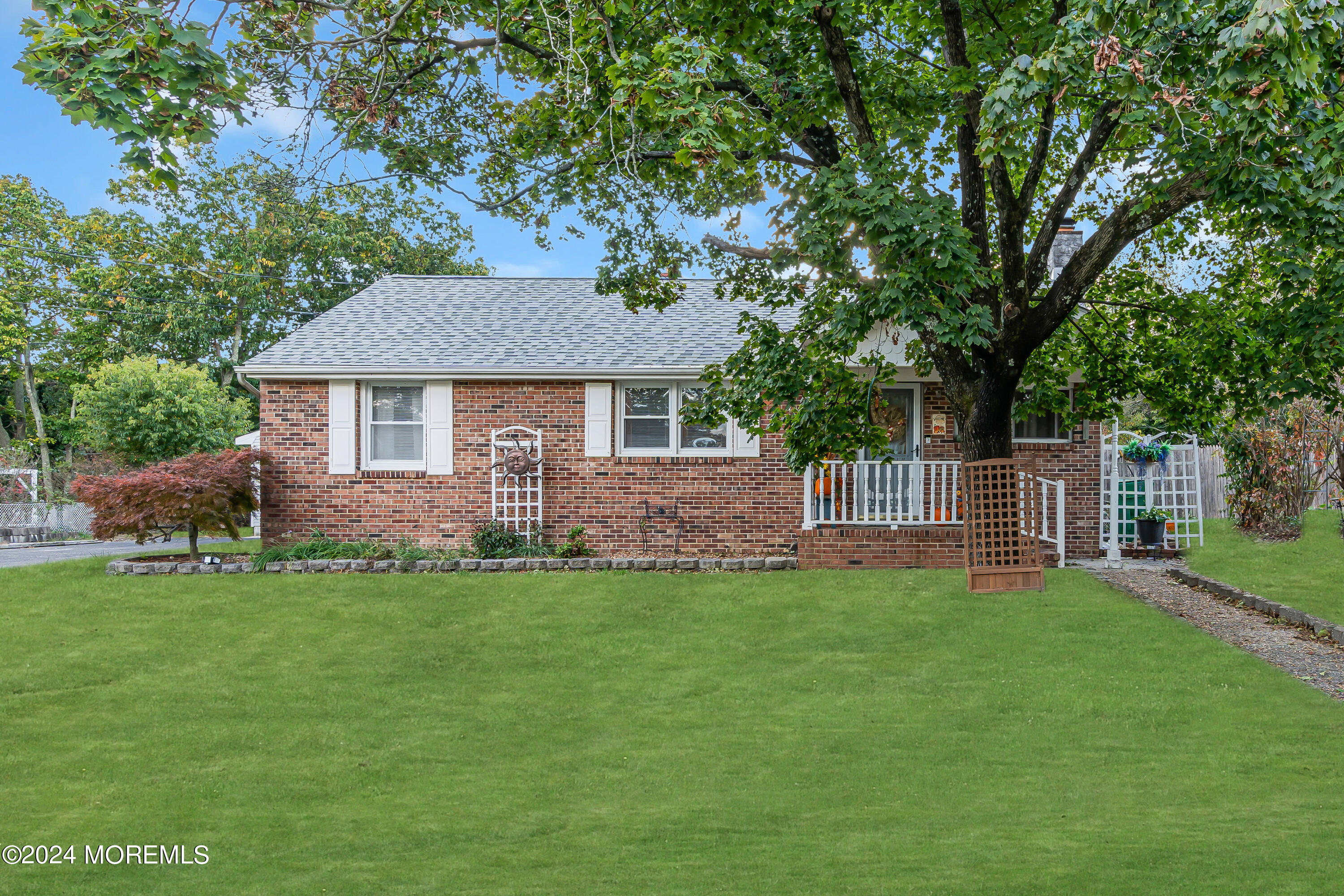 13 Hemlock Road Howell, NJ 07731 - Photo 1 of 48 a front view of a house with a garden