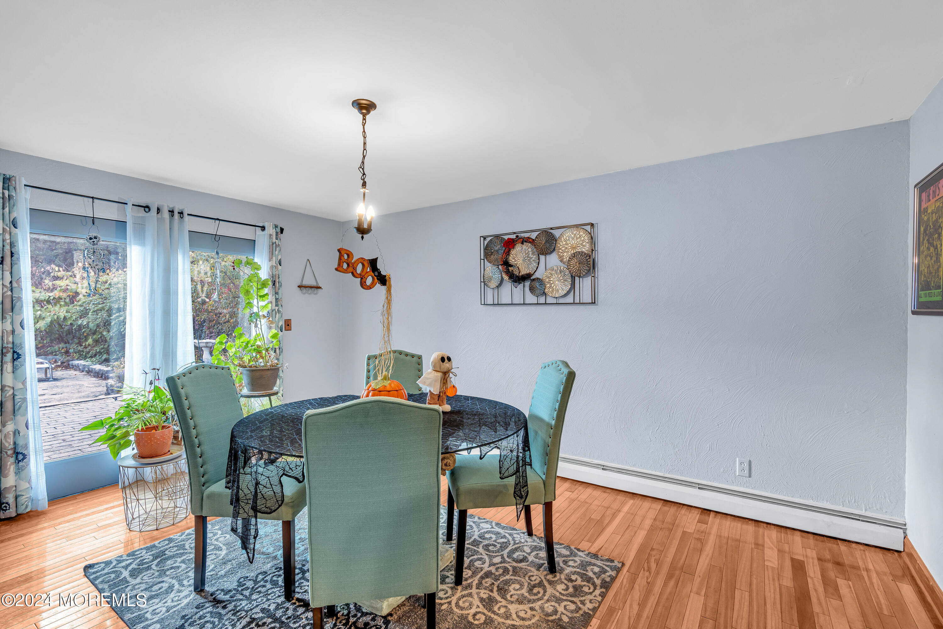 13 Hemlock Road Howell, NJ 07731 - Photo 11 of 48 a dining room with furniture a rug and wooden floor