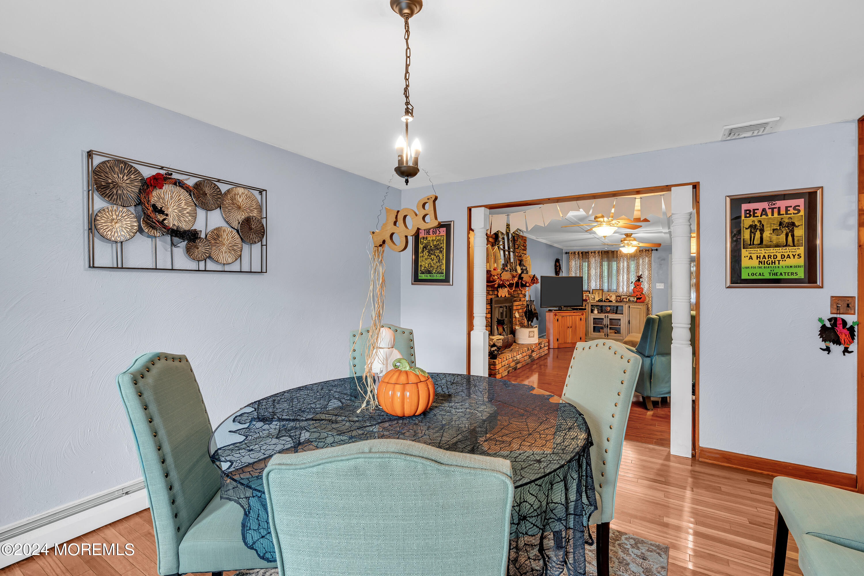 13 Hemlock Road Howell, NJ 07731 - Photo 12 of 48 a dining room with furniture and wooden floor