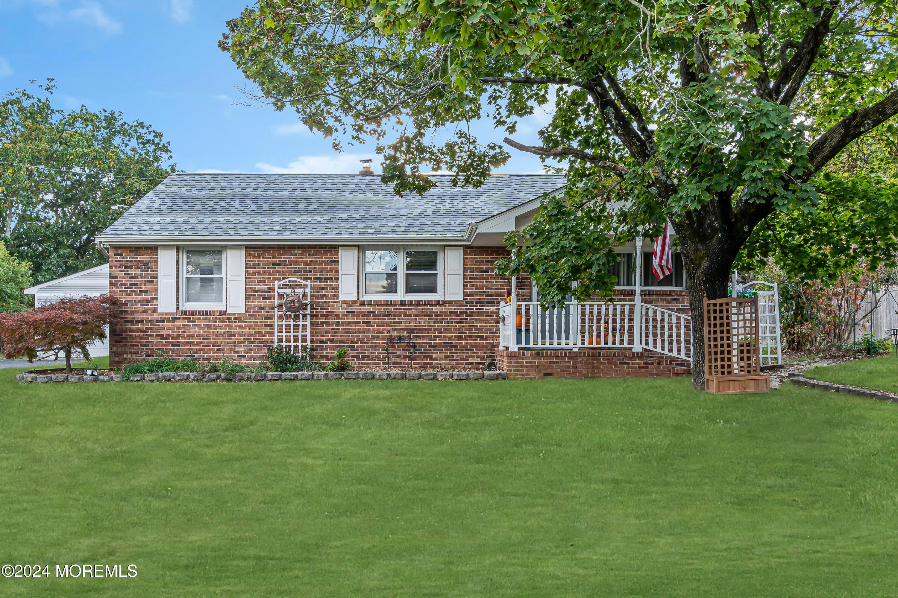 13 Hemlock Road Howell, NJ 07731 - Photo 2 of 48 a front view of a house with a garden