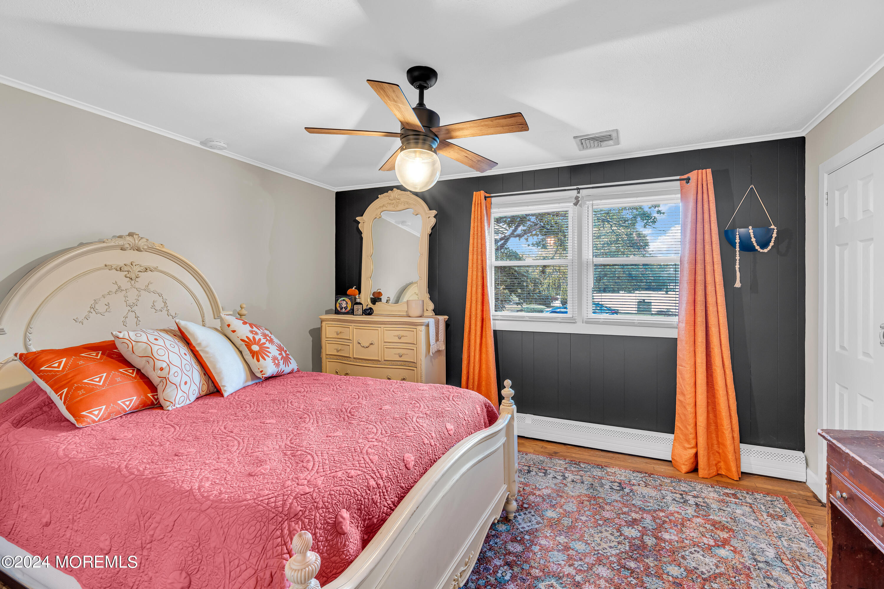 13 Hemlock Road Howell, NJ 07731 - Photo 21 of 48 a bedroom with a bed and wooden floor