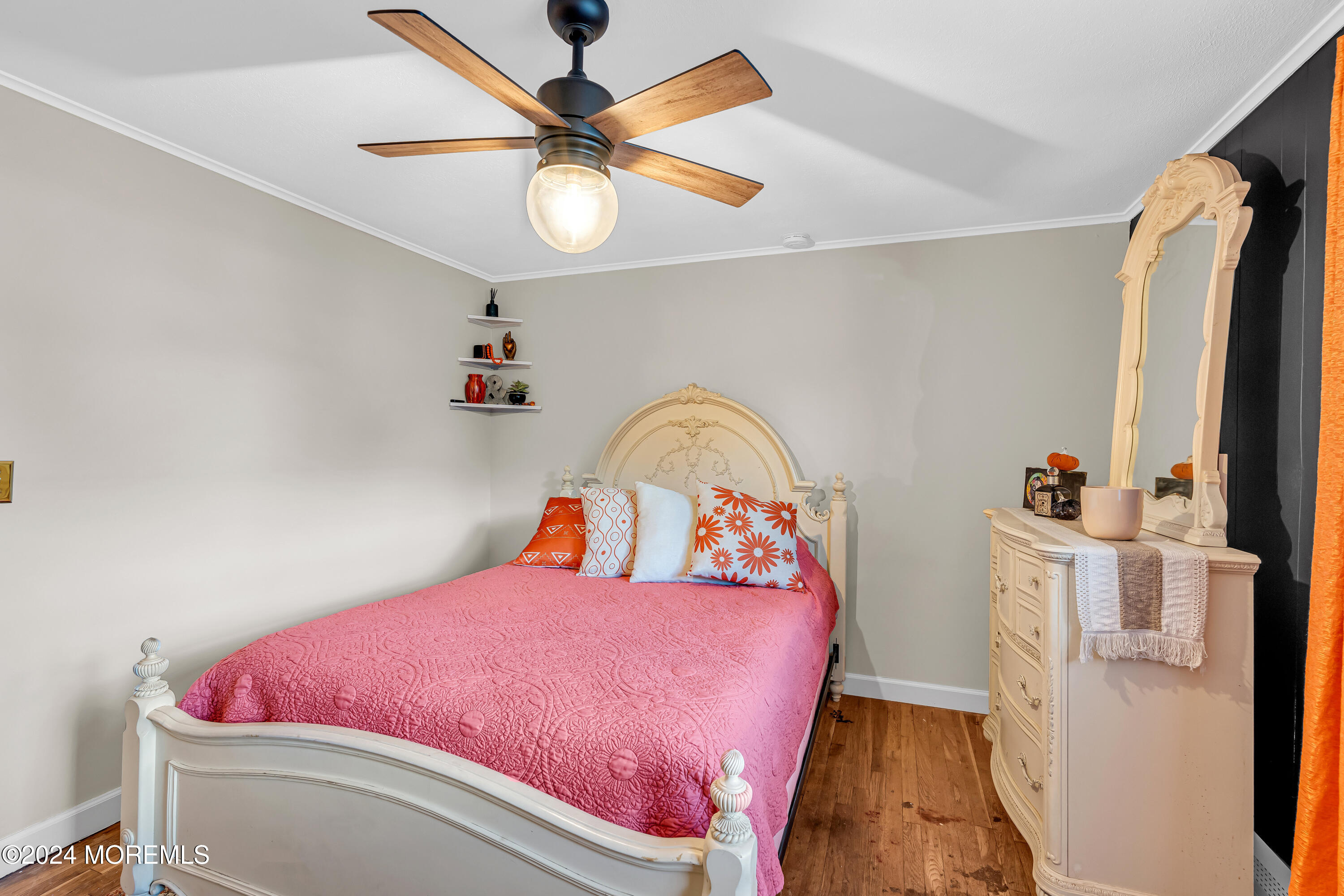 13 Hemlock Road Howell, NJ 07731 - Photo 22 of 48 a bedroom with a bed and a chandelier