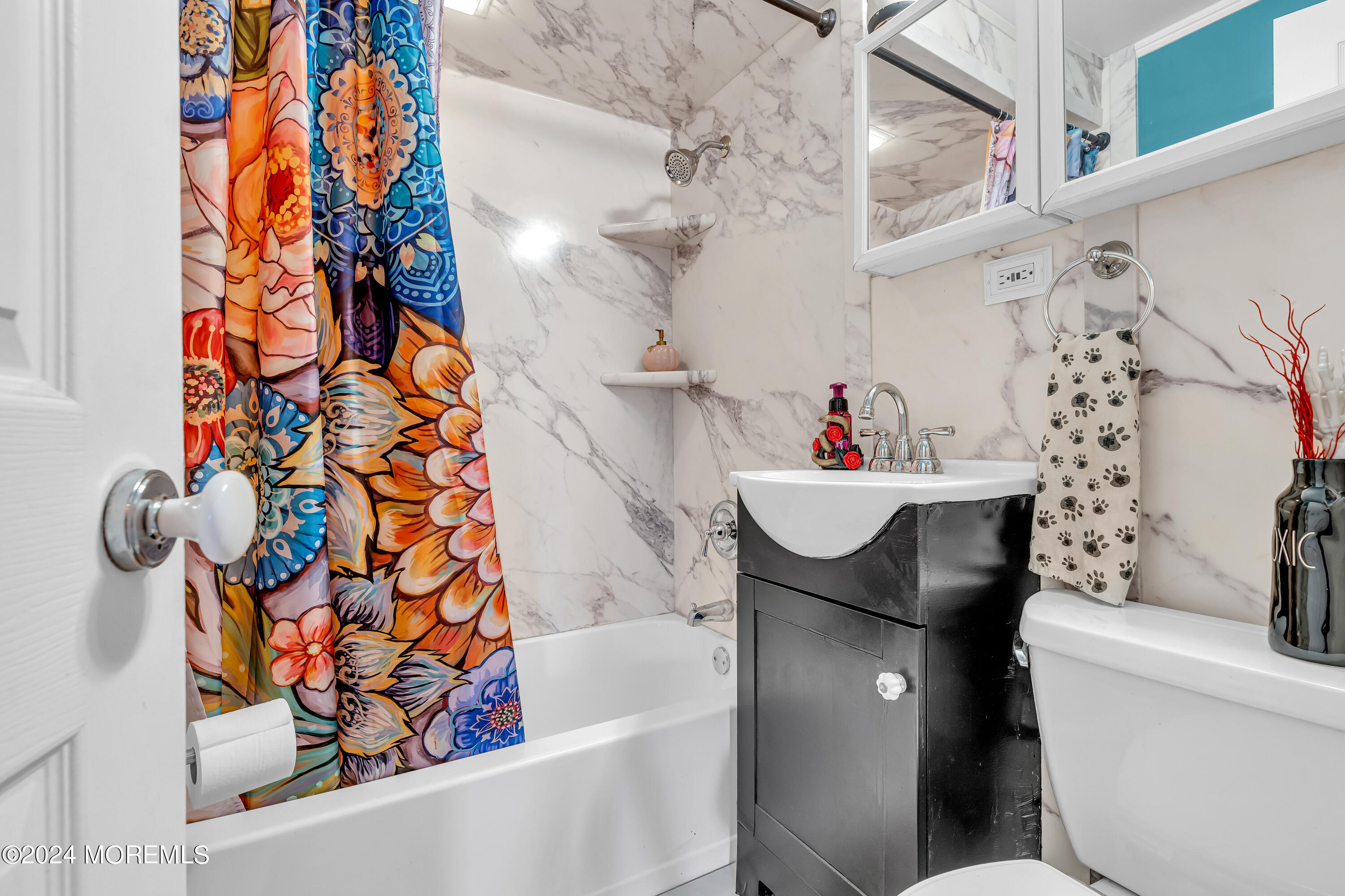 13 Hemlock Road Howell, NJ 07731 - Photo 25 of 48 a bathroom with a sink a toilet and shower curtain