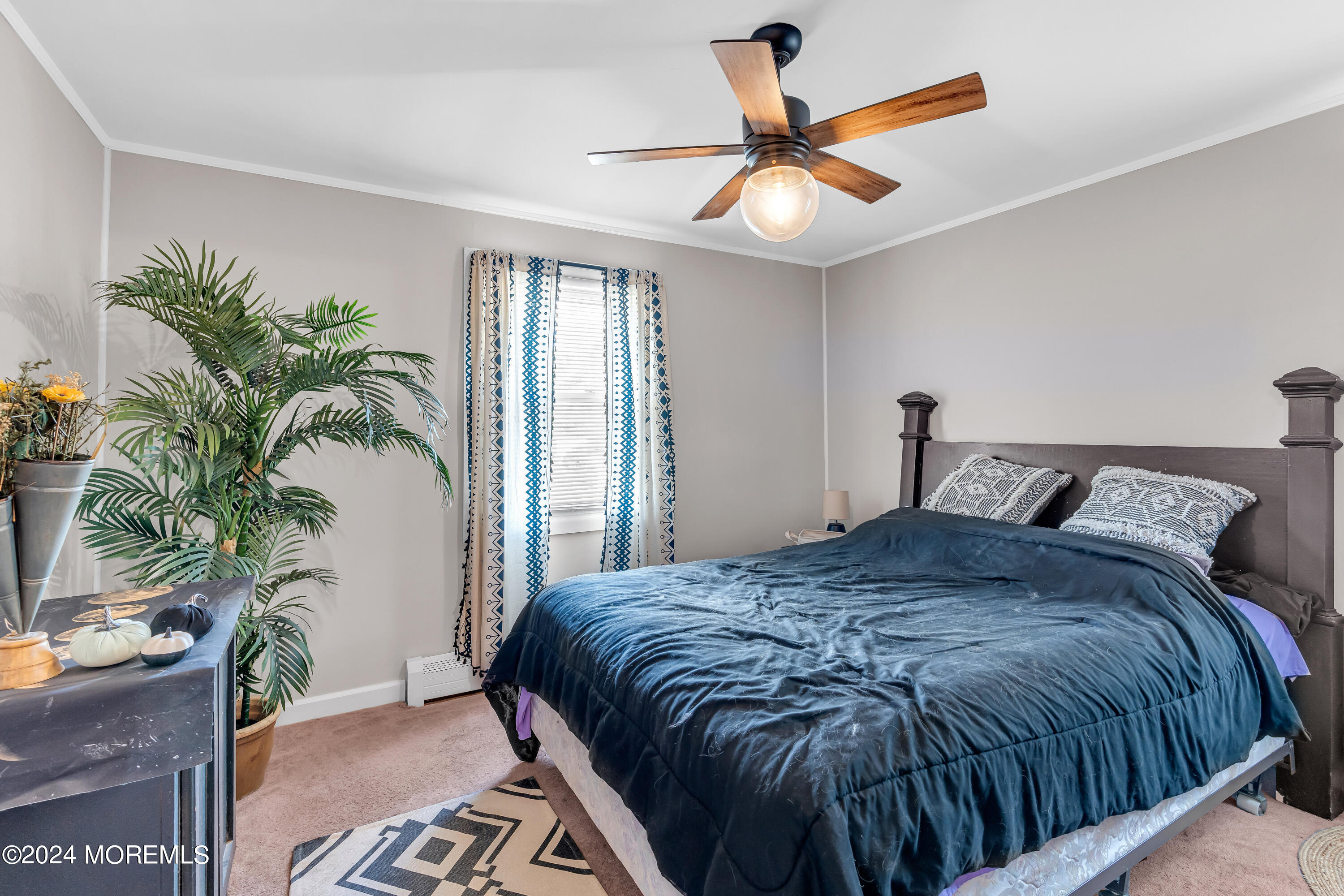13 Hemlock Road Howell, NJ 07731 - Photo 26 of 48 a bedroom with a large bed and a potted plant