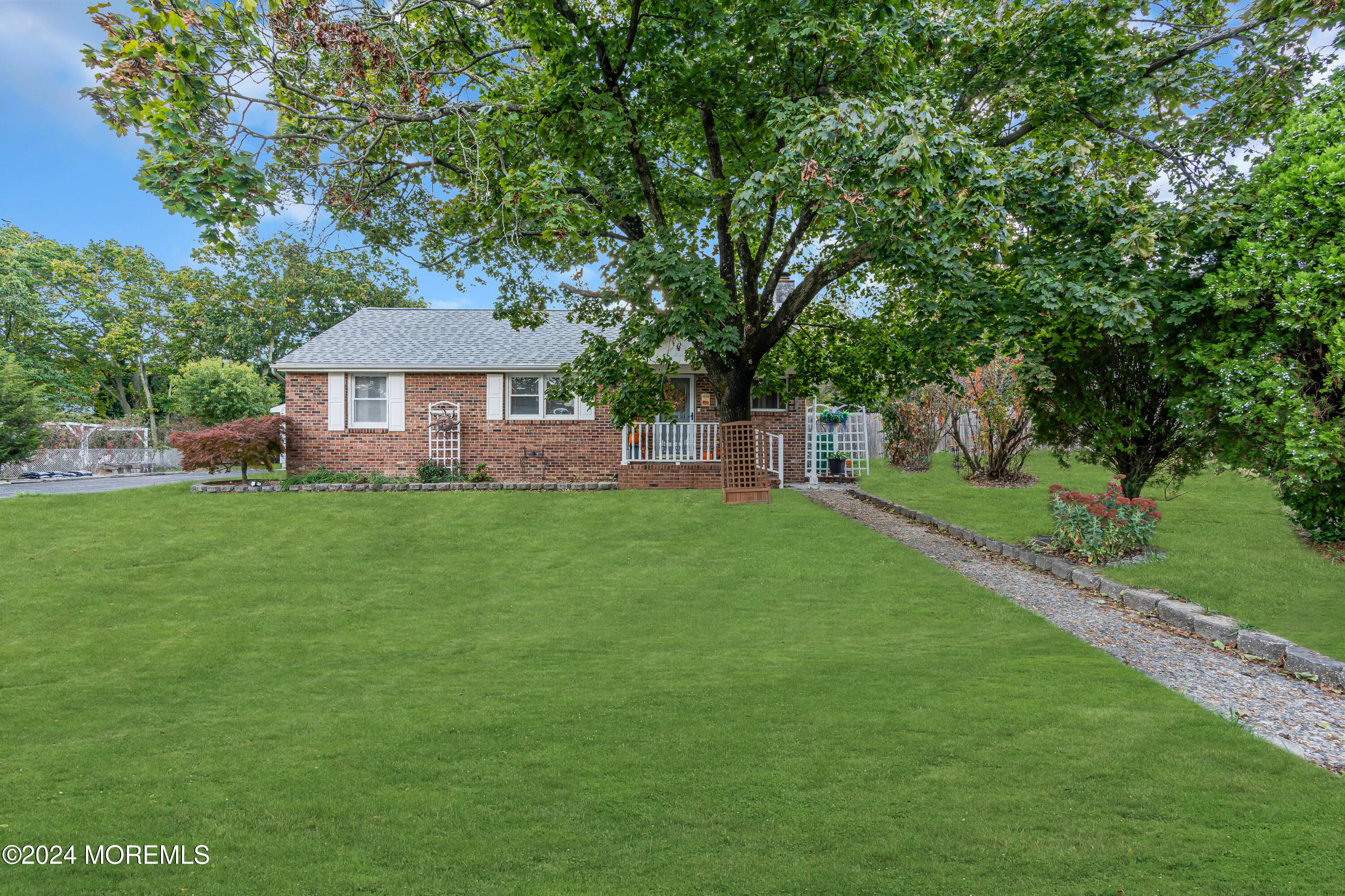 13 Hemlock Road Howell, NJ 07731 - Photo 3 of 48 a front view of a house with a garden