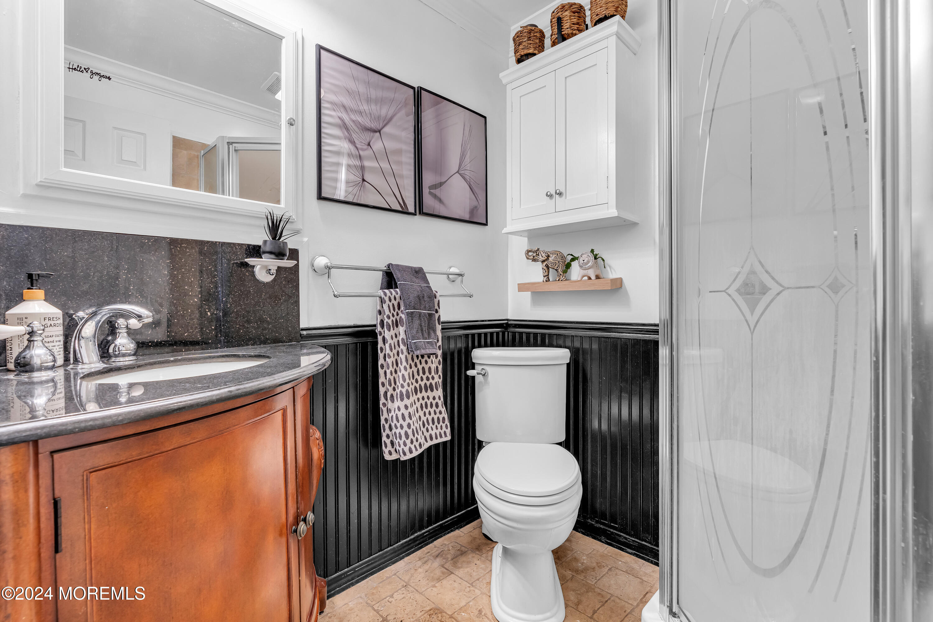 13 Hemlock Road Howell, NJ 07731 - Photo 31 of 48 a bathroom with a toilet a sink and mirror