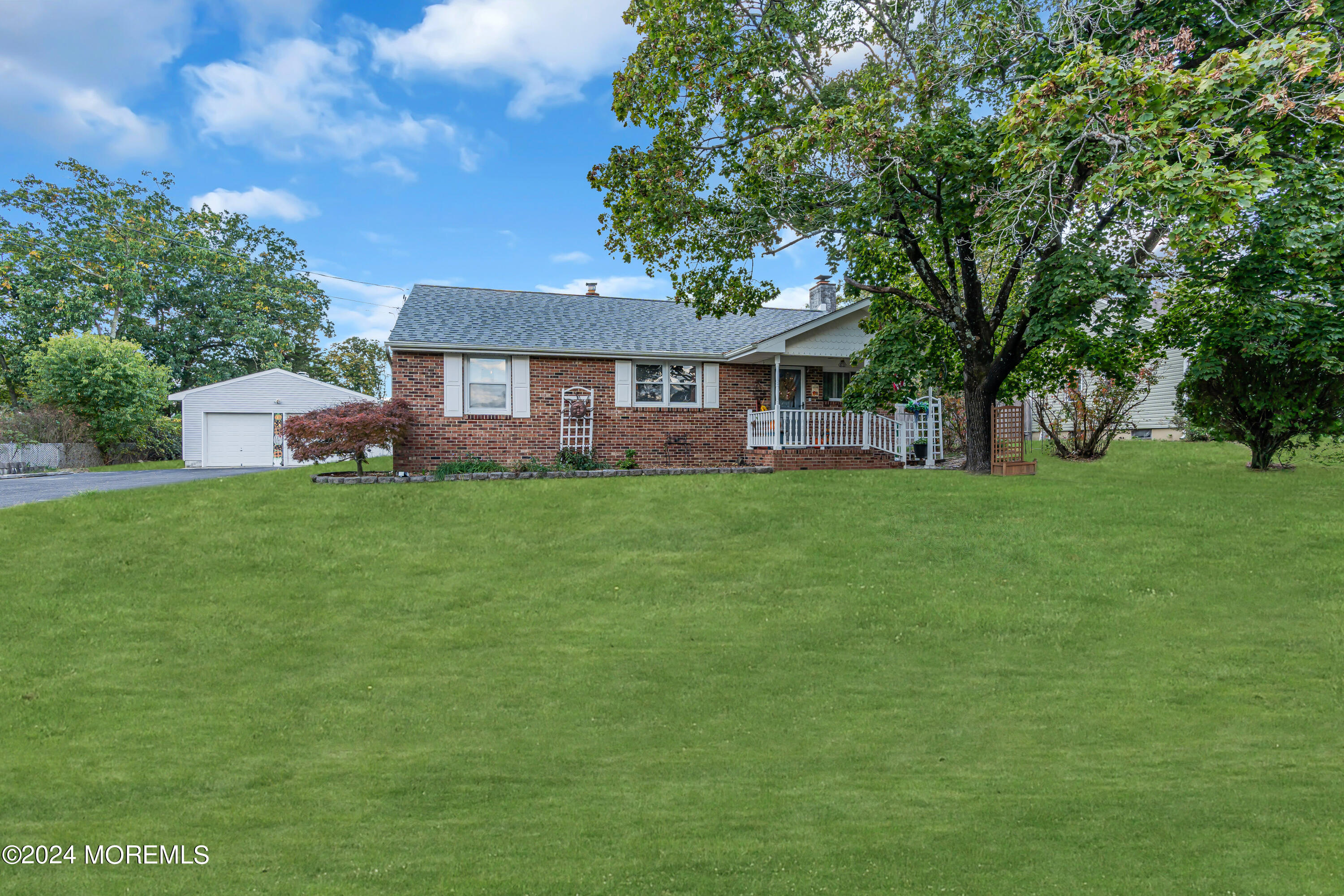 13 Hemlock Road Howell, NJ 07731 - Photo 4 of 48 a view of a house with a big yard and large trees