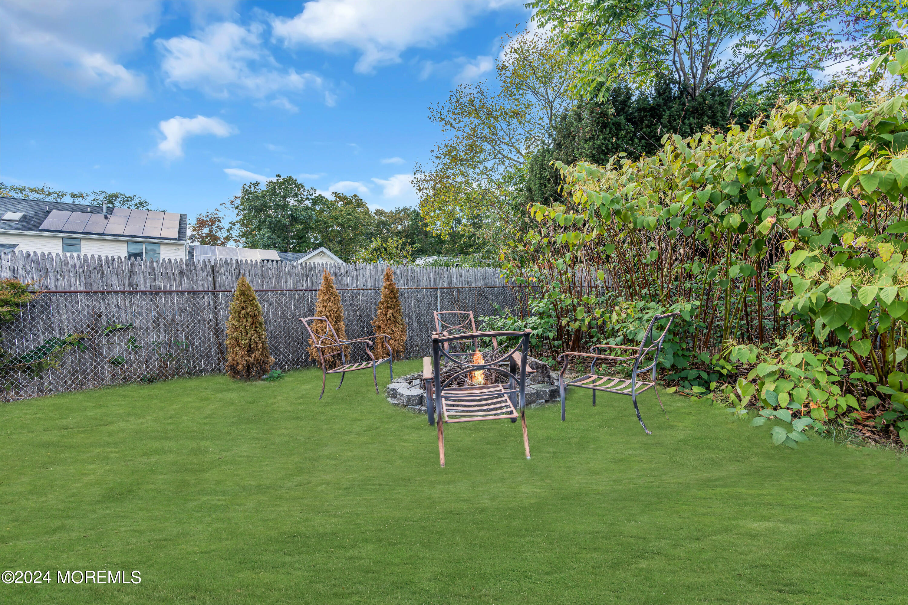 13 Hemlock Road Howell, NJ 07731 - Photo 41 of 48 a table and chairs in the garden