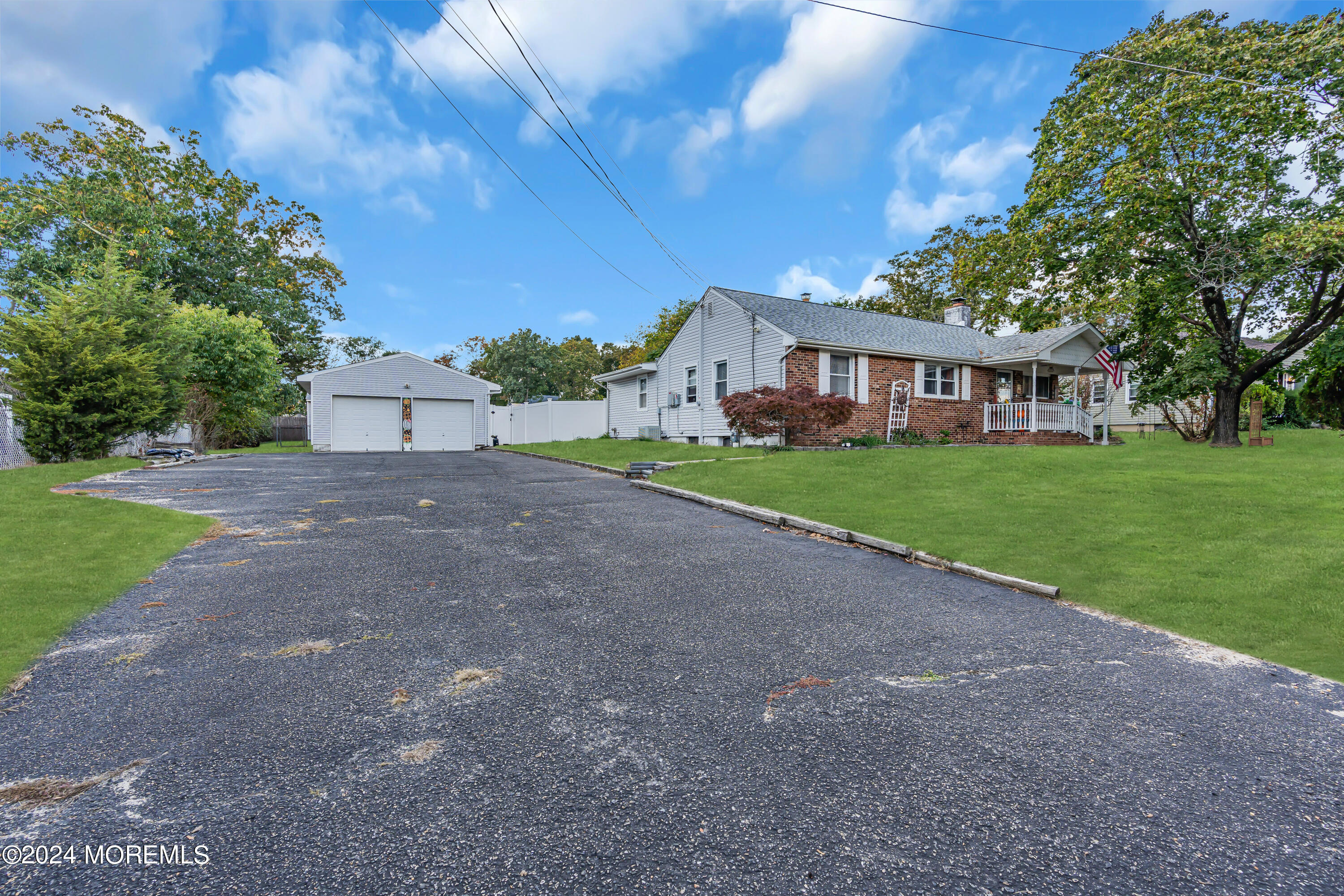 13 Hemlock Road Howell, NJ 07731 - Photo 5 of 48 a front view of a house with a yard and trees