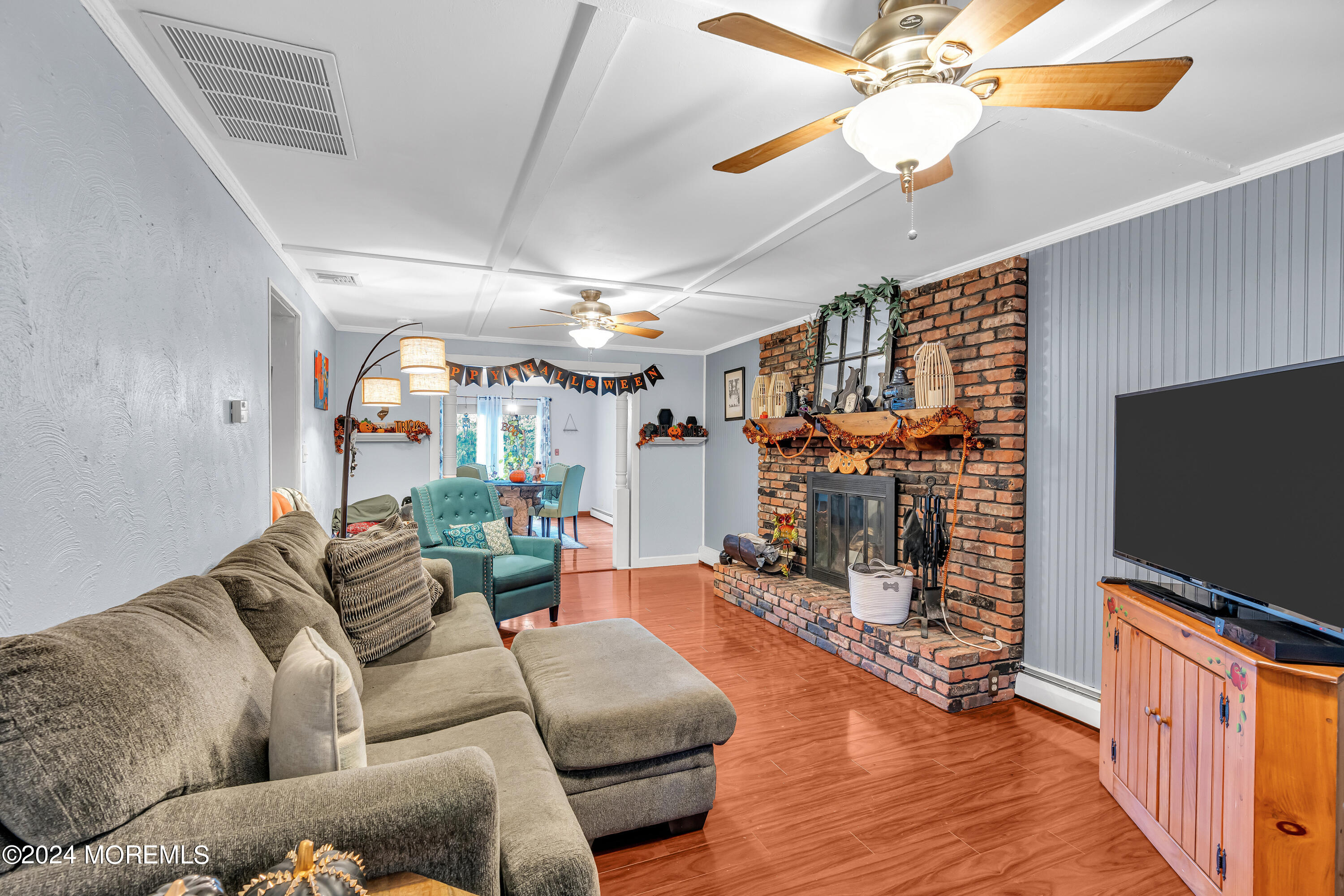 13 Hemlock Road Howell, NJ 07731 - Photo 8 of 48 a living room with furniture and a flat screen tv
