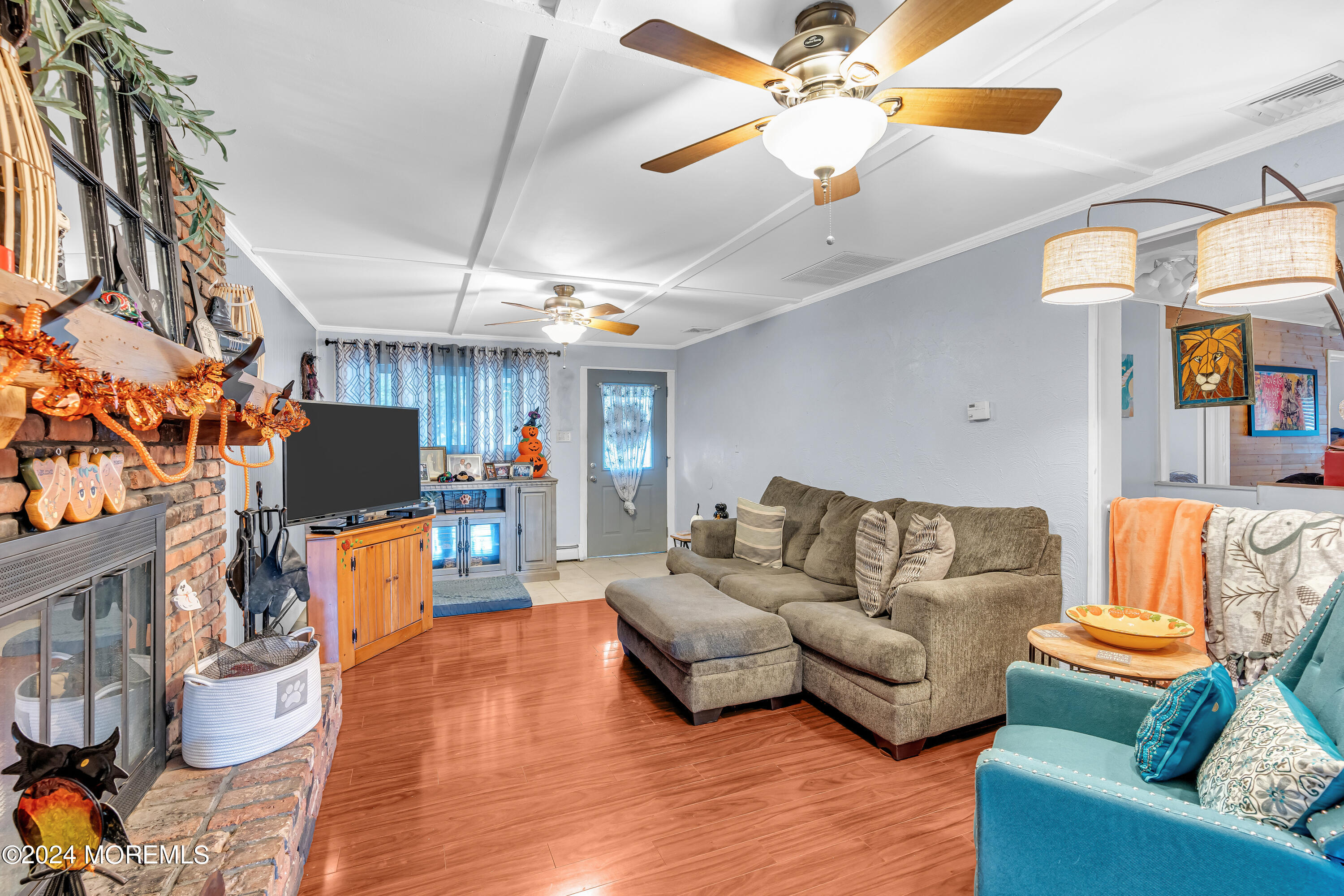 13 Hemlock Road Howell, NJ 07731 - Photo 10 of 48 a living room with furniture and a flat screen tv