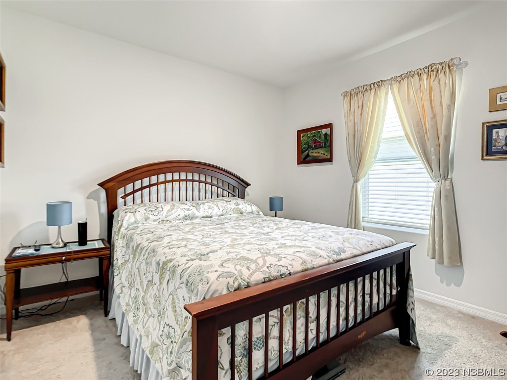 126 Old Mill Edgewater, FL 32141 - Photo 25 of 50 a bedroom with a bed and a window