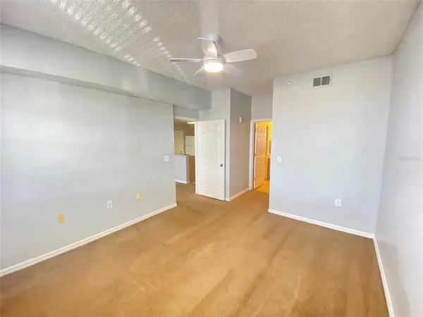 a view of an empty room with a chandelier