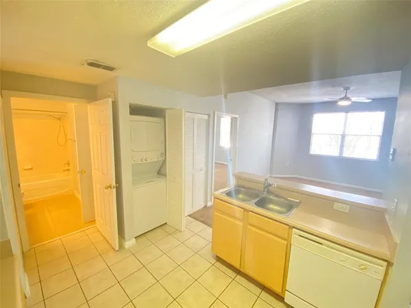 a bathroom with a tub sink and shower