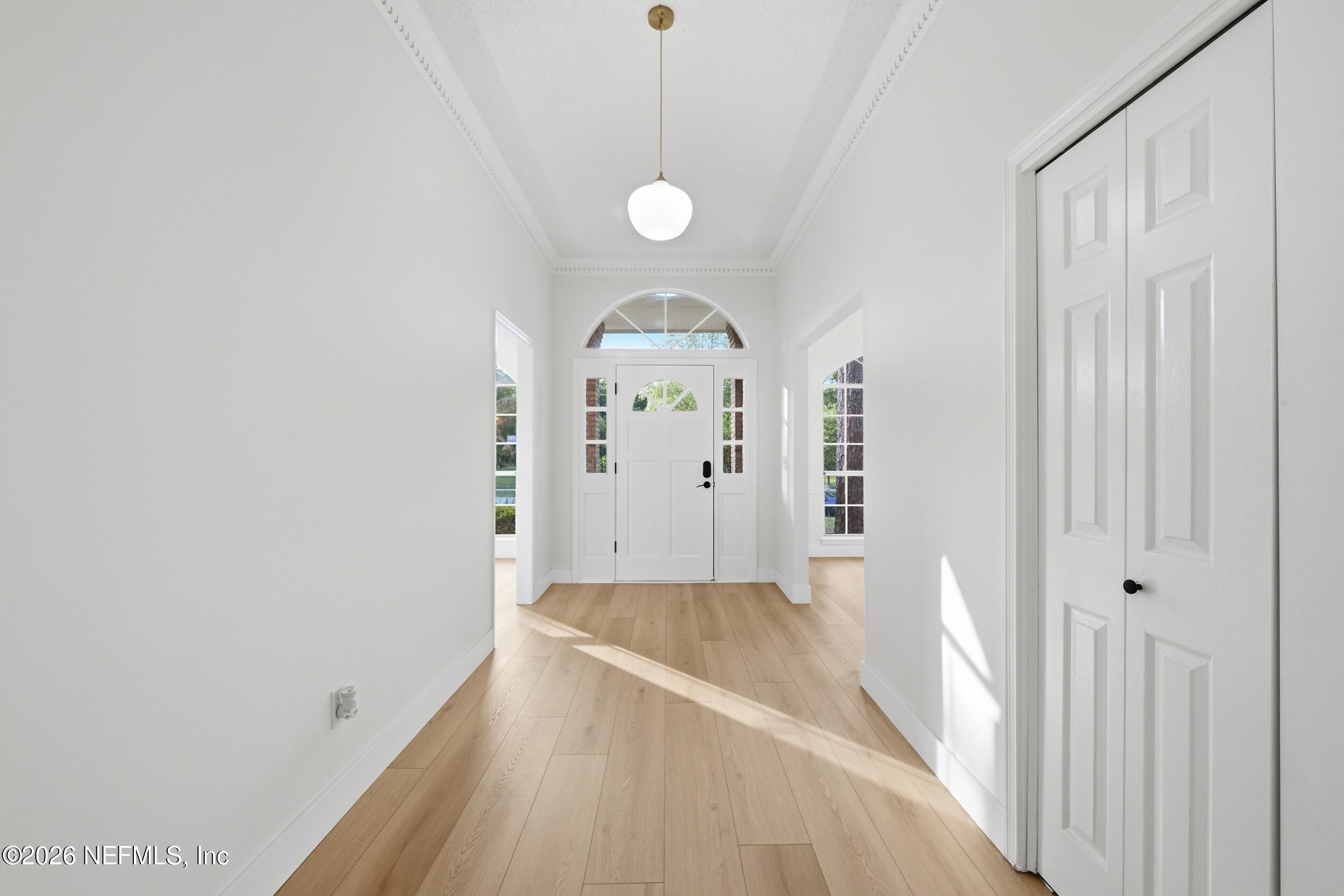 3286 Marbon Road Jacksonville, FL 32223 - Photo 5 of 36 wooden floor in an empty room with a window