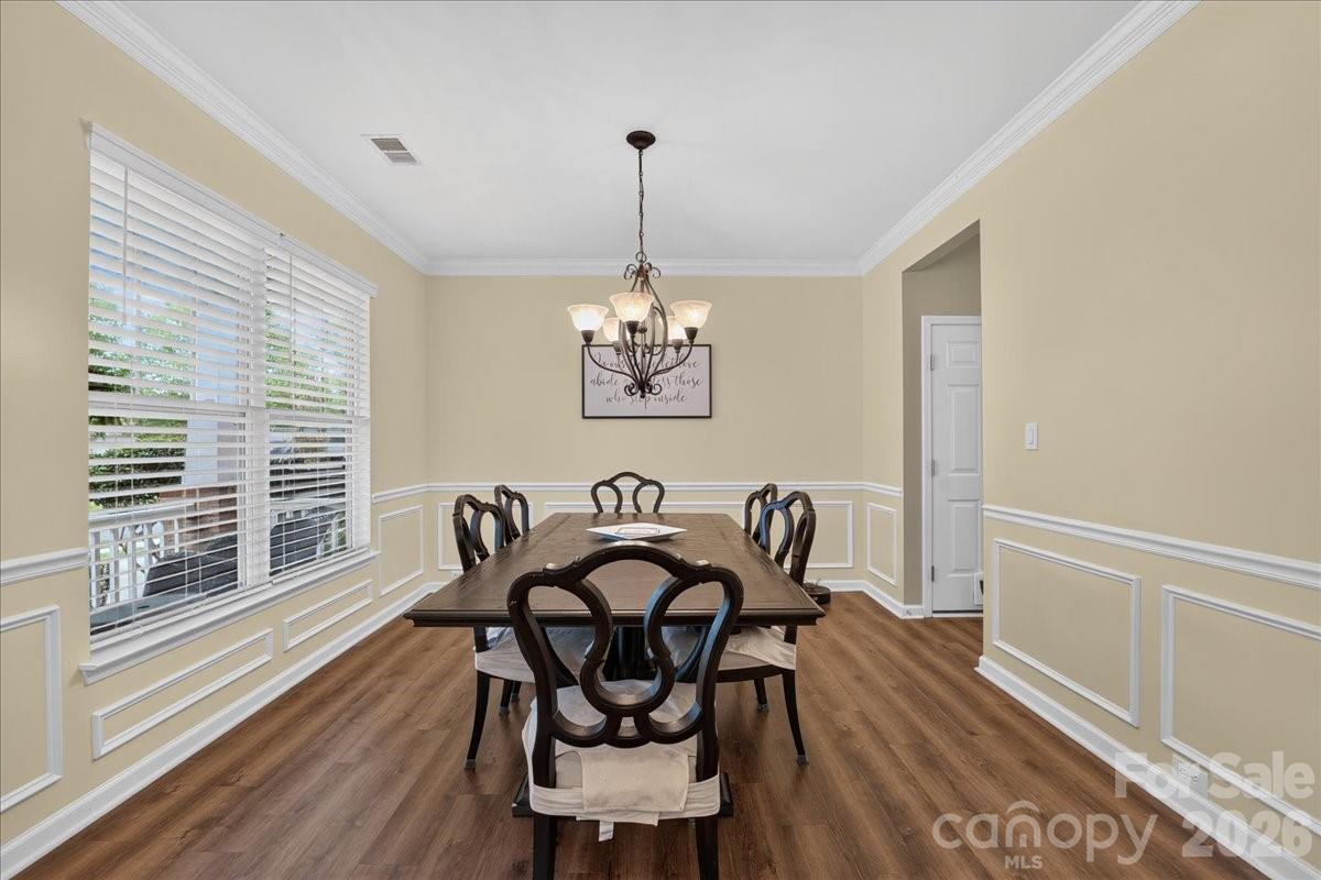 8006 Fine Robe Drive Indian Trail, NC 28079 - Photo 3 of 36 a dining room with furniture and window