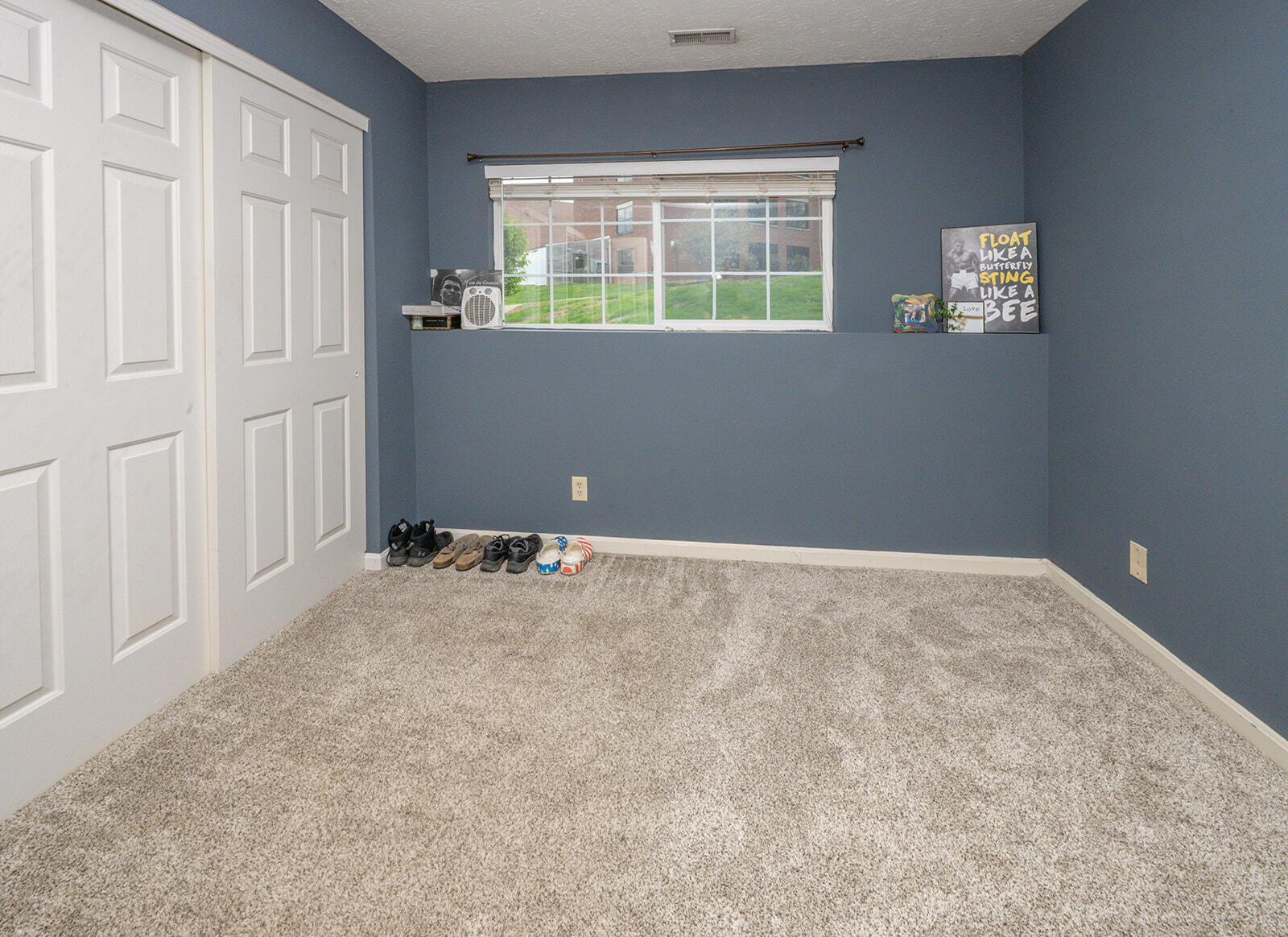 29 School Road Walton, KY 41094 - Photo 17 of 30 Spacious interior room featuring plush gray carpeting, a large double-door closet with white paneled doors, and a single-pane window with white trim
